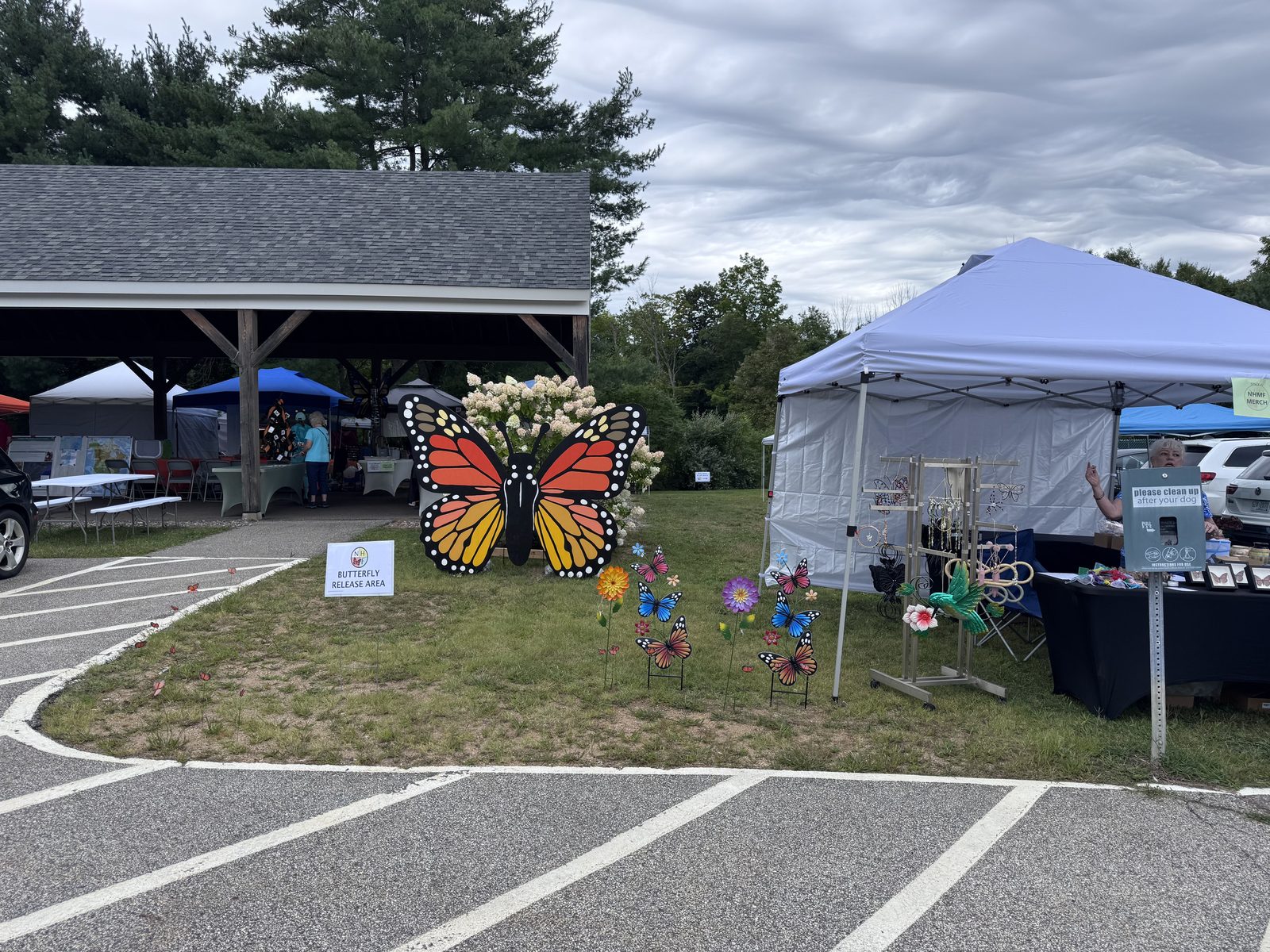 Large monarch butterfly decoration near festival craft tables