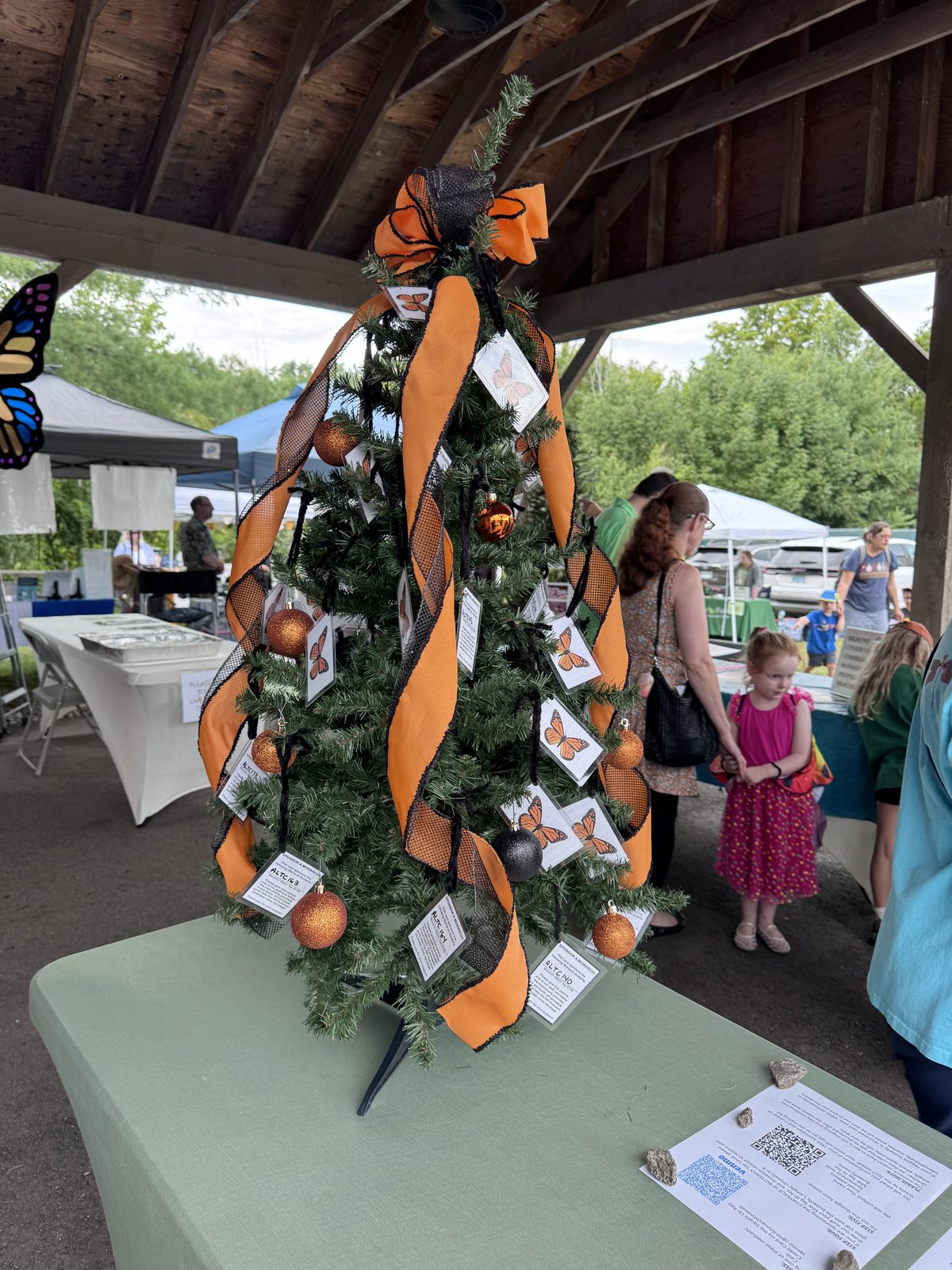Decorated tree with monarch ornaments under the pavilion