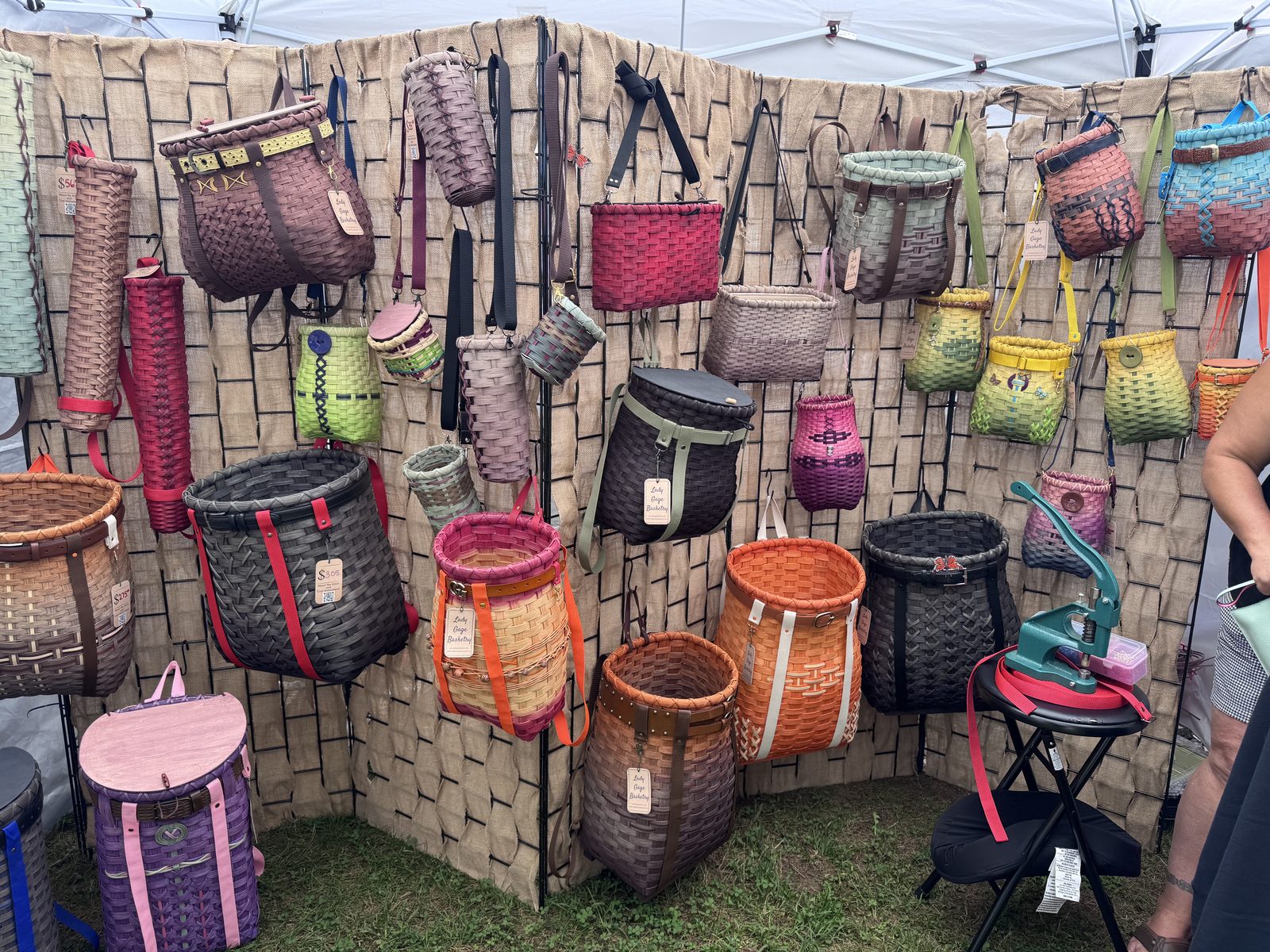 Handwoven baskets and bags at a vendor booth