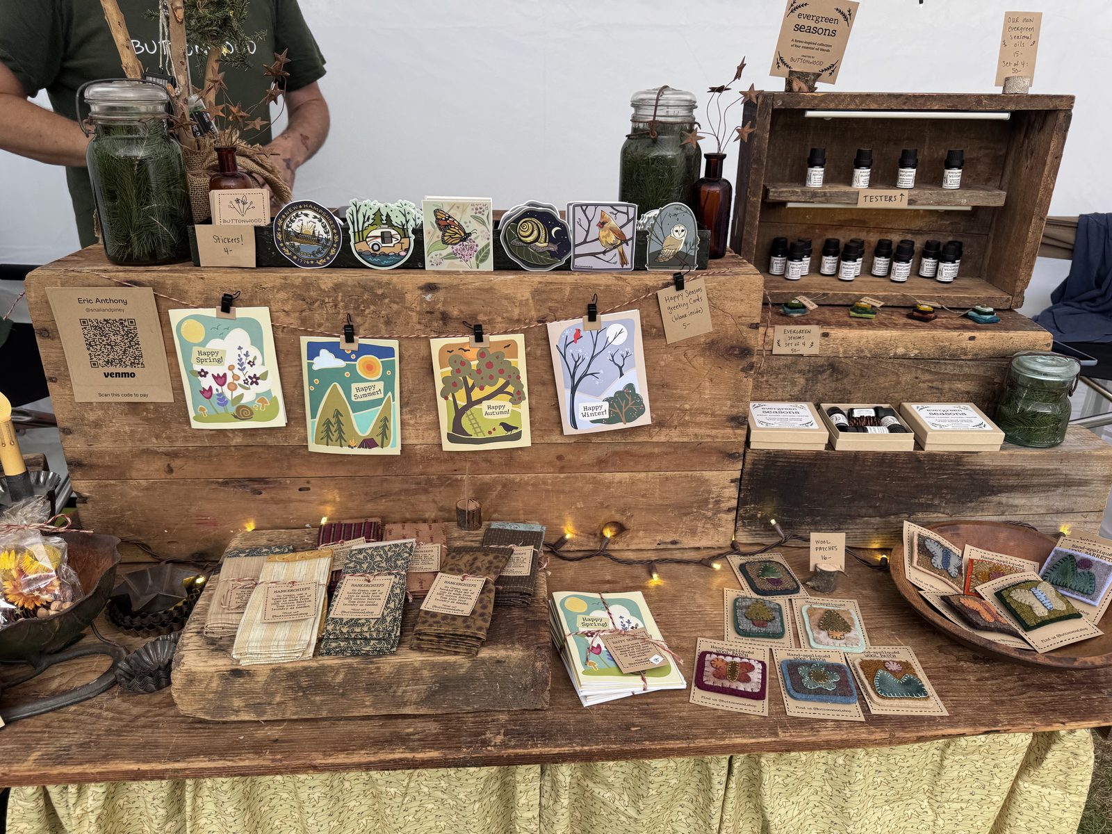 Vendor table with handmade cards and nature-inspired art